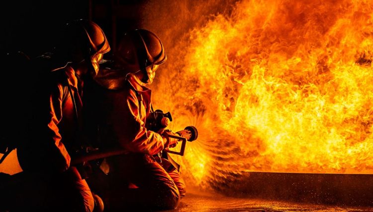 Firefighters Spraying Down Flame Night 1024x585